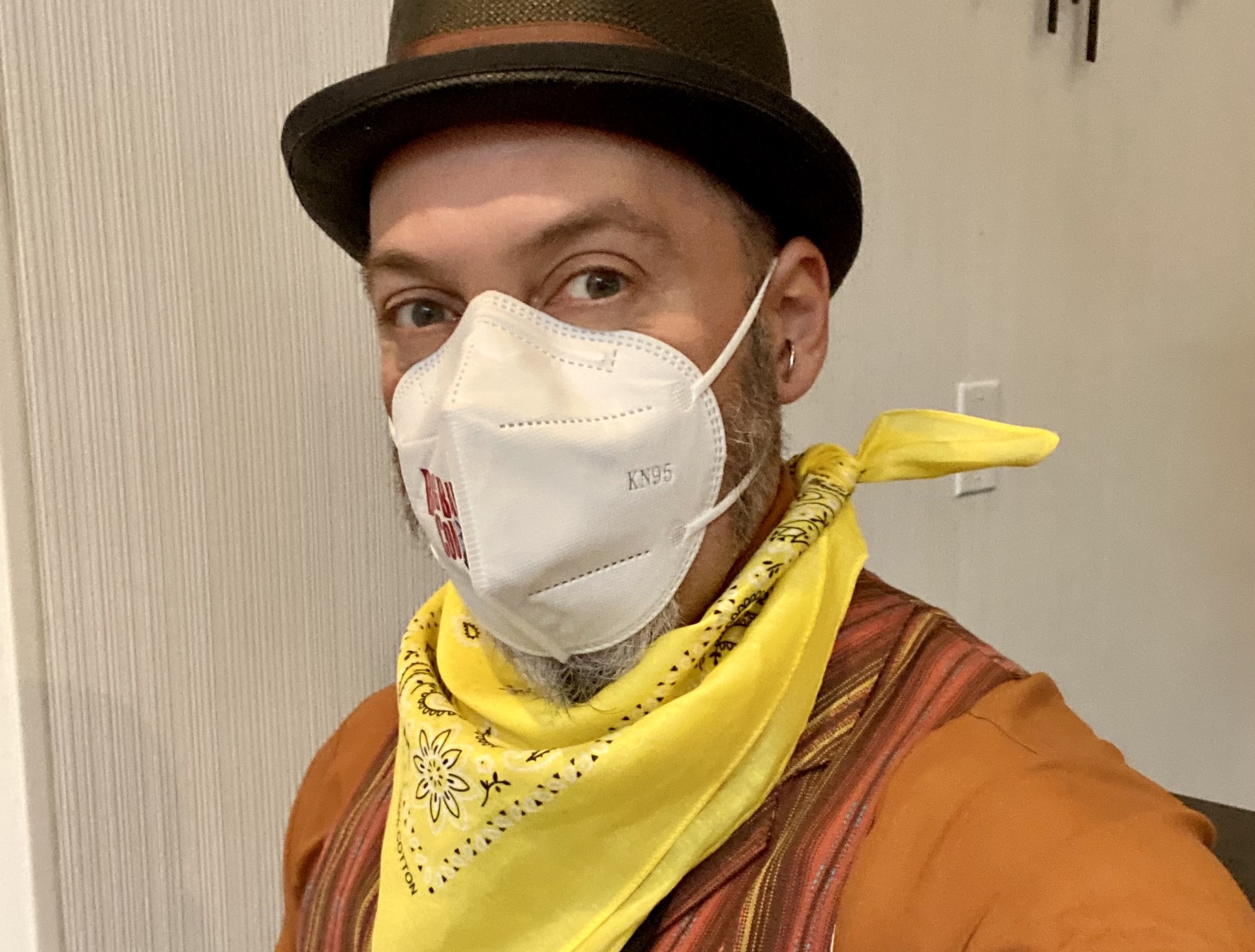 Me doing my Big Bad Con greeter shift, dressed snappy with a bowler, vest, tie, my yellow Ranger bandana, and a N95 mask.